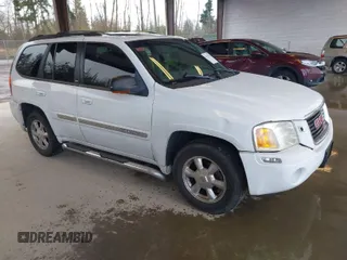 2003 GMC Envoy SLE with VIN 1GKDT13SX32319740, listed as a IAAI auction lot 41923578 with 210,811 mi miles. Bid and sale history available at carsss.com. Image 1.