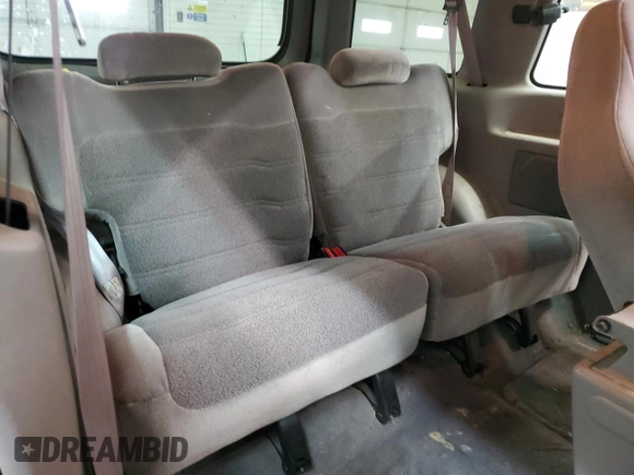 1999 Ford Explorer Sport z VIN 1FMYU24X3XUB23512, wystawiony jako Copart lot #82668734 z przebiegiem 228 701 mil mil oraz Szkoda całkowita • Salvage title. Historia ofert i sprzedaży dostępna na DreamBid. Obrazek 11.