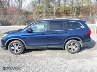 2017 Honda Pilot EX-L with VIN 5FNYF5H52HB031634, listed as a IAAI auction lot 41145133 with 164,668 mi miles. Bid and sale history available at carsss.com. Image 14.