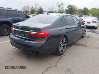 2019 BMW 7 Series 750i with VIN WBA7F0C50KGM26010, listed as a IAAI auction lot 42188421 with 71,576 mi miles and . Bid and sale history available at DreamBid. Image 4.