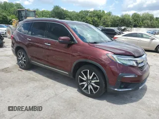 2019 Honda Pilot Touring 7-Passenger with VIN 5FNYF6H6XKB094020, listed as a Copart auction lot 61460255 with 135,149 mi miles and Salvage title. Bid and sale history available at DreamBid. Image 4.