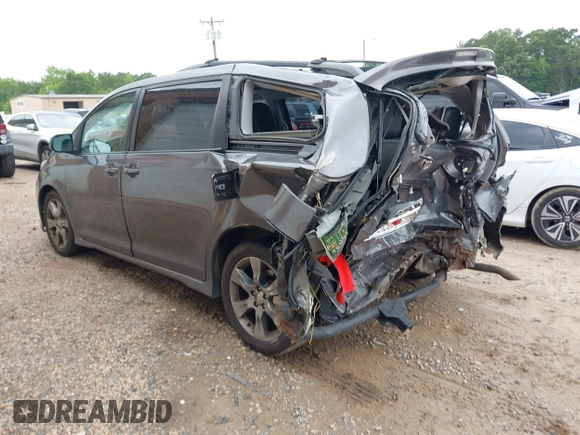2012 Toyota Sienna SE with VIN 5TDXK3DC2CS235211, listed as a IAAI auction lot 42390354 with 242,602 mi miles and . Bid and sale history available at DreamBid. Image 3.