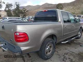 2003 Ford F-150 XLT with VIN 1FTRW07623KD34295, listed as a IAAI auction lot 41515387 with 163,506 mi miles. Bid and sale history available at carsss.com. Image 4.