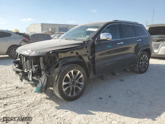 2017 Jeep Grand Cherokee Overland with VIN 1C4RJECG2HC614746, listed as a Copart auction lot 77362304 with 86,330 mi miles and Salvage Title. Bid and sale history available at carsss.com. Image 1.