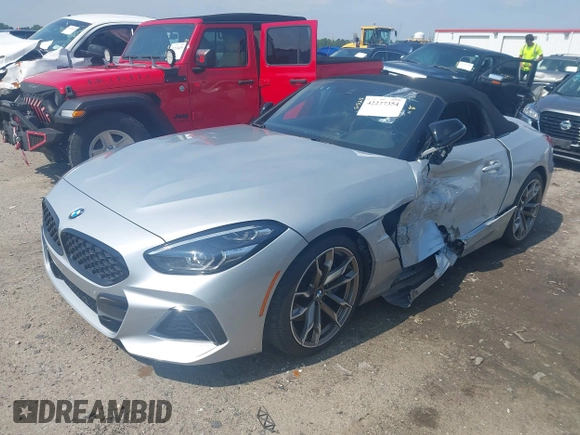 2021 BMW Z4 sDriveM40i z VIN WBAHF9C00MWX17614, wystawiony jako IAAI lot #42277354 z przebiegiem 26 615 mil mil oraz . Historia ofert i sprzedaży dostępna na DreamBid. Obrazek 16.