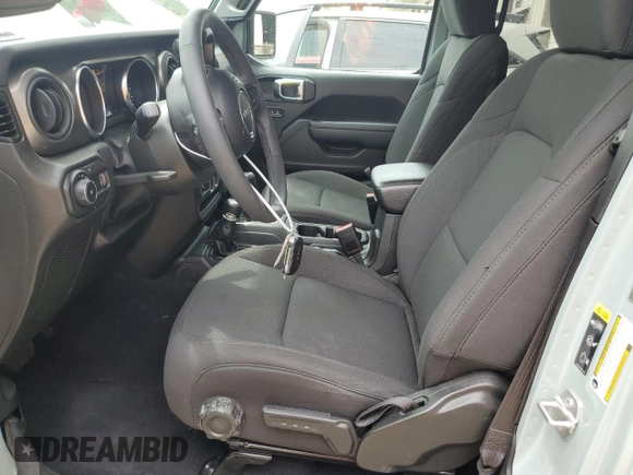 2023 Jeep Wrangler Sport with VIN 1C4HJXDN0PW643485, listed as a Copart auction lot 59783564 with 14,001 mi miles and Salvage Title. Bid and sale history available at DreamBid. Image 7.