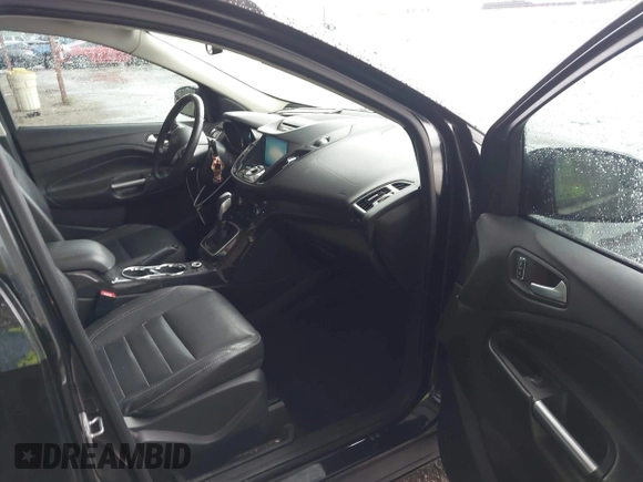2014 Ford Escape Titanium z VIN 1FMCU0J96EUA84108, wystawiony jako IAAI lot #42114002 z przebiegiem 176 735 mil mil oraz . Historia ofert i sprzedaży dostępna na DreamBid. Obrazek 5.