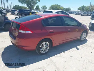 2010 Honda Insight EX with VIN JHMZE2H71AS021062, listed as a IAAI auction lot 41857350 with 45,558 mi miles and . Bid and sale history available at carsss.com. Image 4.