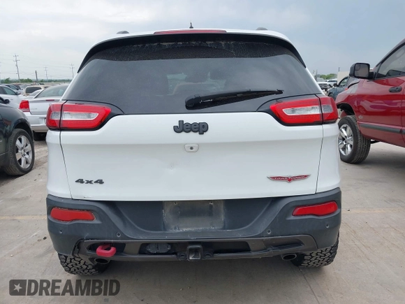 2015 Jeep Cherokee Trailhawk with VIN 1C4PJMBS9FW623740, listed as a IAAI auction lot 42131019 with 155,105 mi miles and . Bid and sale history available at DreamBid. Image 16.