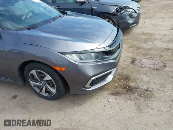 2019 Honda Civic LX with VIN 19XFC2F61KE037495, listed as a IAAI auction lot 41891007 with 90,262 mi miles and . Bid and sale history available at DreamBid. Image 6.