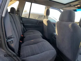 1997 Jeep Grand Cherokee Laredo with VIN 1J4GZ58S7VC685900, listed as a Copart auction lot 82105214 with 151,036 mi miles and Salvage Title. Bid and sale history available at carsss.com. Image 10.