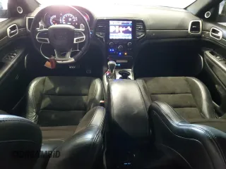 2019 Jeep Grand Cherokee Trackhawk with VIN 1C4RJFN92KC564748, listed as a Copart auction lot 82677504 with 48,528 mi miles and Salvage title. Bid and sale history available at DreamBid. Image 8.