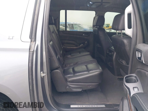 2019 Chevrolet Suburban LT with VIN 1GNSKHKCXKR405555, listed as a IAAI auction lot 42188860 with 143,435 mi miles and . Bid and sale history available at DreamBid. Image 8.
