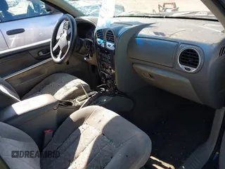 2003 GMC Envoy SLE with VIN 1GKDS13S732134354, listed as a IAAI auction lot 41305506 with 221,733 mi miles. Bid and sale history available at carsss.com. Image 5.