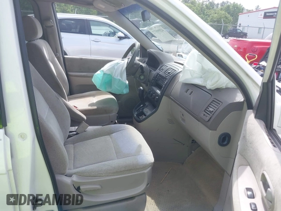 2005 Kia Sedona LX with VIN KNDUP132056702484, listed as a IAAI auction lot 42099572 with 195,528 mi miles and . Bid and sale history available at DreamBid. Image 5.
