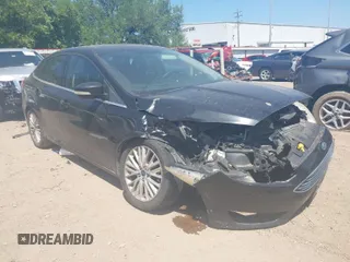 2015 Ford Focus Titanium with VIN 1FADP3J24FL385526, listed as a IAAI auction lot 42011712 with 162,696 mi miles and . Bid and sale history available at carsss.com. Image 1.