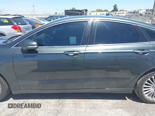 2016 Ford Fusion Titanium with VIN 3FA6P0K98GR196951, listed as a IAAI auction lot 42538508 with 186,298 mi miles and . Bid and sale history available at DreamBid. Image 14.