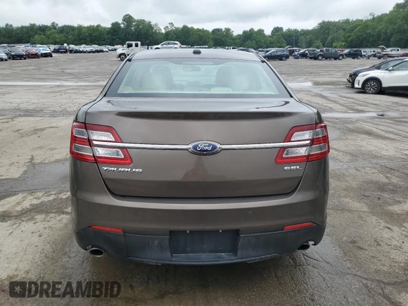 2015 Ford Taurus SEL z VIN 1FAHP2E84FG102075, wystawiony jako Copart lot #59740265 z przebiegiem 90 669 mil mil oraz Szkoda całkowita • Salvage title. Historia ofert i sprzedaży dostępna na DreamBid. Obrazek 6.