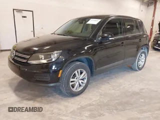 2014 Volkswagen Tiguan SE z VIN WVGAV3AX9EW614094, wystawiony jako IAAI lot #42350601 z przebiegiem 128 996 mil mil oraz . Historia ofert i sprzedaży dostępna na DreamBid. Obrazek 2.