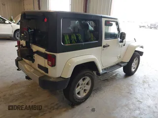 2015 Jeep Wrangler Sahara with VIN 1C4AJWBG7FL648621, listed as a IAAI auction lot 42439781 with 107,148 mi miles and . Bid and sale history available at DreamBid. Image 4.