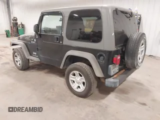 2006 Jeep Wrangler Sport Right Hand Drive with VIN 1J4F449S56P741328, listed as a IAAI auction lot 41476847 with 67,203 mi miles. Bid and sale history available at carsss.com. Image 3.