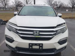 2016 Honda Pilot Touring with VIN 5FNYF6H95GB062089, listed as a IAAI auction lot 41810378 with 74,704 mi miles and . Bid and sale history available at DreamBid. Image 12.