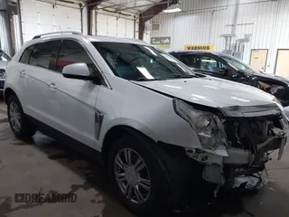 2014 Cadillac SRX Performance Collection z VIN 3GYFNFE36ES615440, wystawiony jako IAAI lot #41830849 z przebiegiem 125 128 mil mil oraz . Historia ofert i sprzedaży dostępna na DreamBid. Obrazek 1.