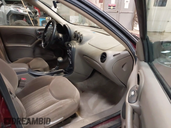 2002 Pontiac Grand Am SE z VIN 1G2NE52F92C291335, wystawiony jako IAAI lot #41665150 z przebiegiem 75 552 mil mil oraz . Historia ofert i sprzedaży dostępna na DreamBid. Obrazek 5.