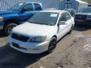 2003 Mitsubishi Lancer LS with VIN JA3AJ36E73U054672, listed as a IAAI auction lot 42002271 with 263,568 mi miles. Bid and sale history available at carsss.com. Image 2.