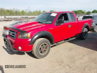 2007 Ford F-150 STX with VIN 1FTRX14W37FA65987, listed as a IAAI auction lot 42064283 with 164,730 mi miles. Bid and sale history available at carsss.com. Image 2.