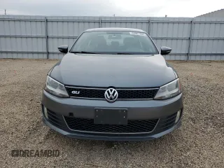 2014 Volkswagen Jetta GLI z VIN 3VW4T7AJ2EM245201, wystawiony jako Copart lot #64901935 z przebiegiem 147 799 mil mil oraz Czysty tytuł • Clean title. Historia ofert i sprzedaży dostępna na DreamBid. Obrazek 5.