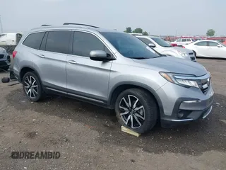 2020 Honda Pilot Elite z VIN 5FNYF6H0XLB020657, wystawiony jako IAAI lot #42274742 z przebiegiem 100 175 mil mil oraz . Historia ofert i sprzedaży dostępna na DreamBid. Obrazek 1.