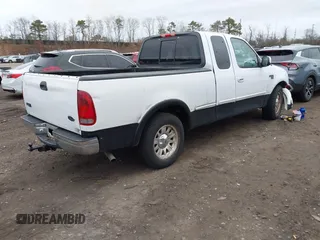 2003 Ford F-150 XL with VIN 1FTRX17W73NA42322, listed as a IAAI auction lot 41680100 with 129,295 mi miles. Bid and sale history available at carsss.com. Image 4.
