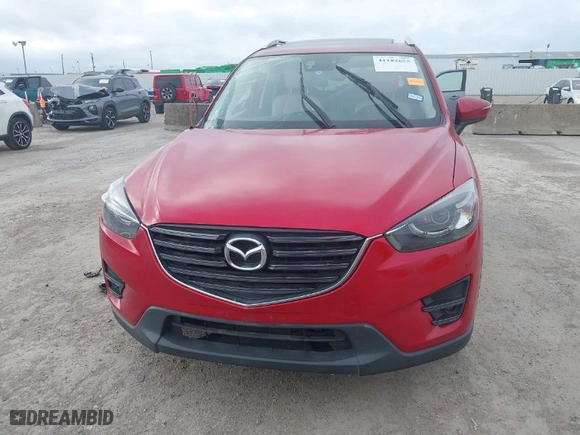 2016 Mazda CX-5 Grand Touring with VIN JM3KE4DYXG0641174, listed as a IAAI auction lot 41182655 with NaN miles. Bid and sale history available at carsss.com. Image 12.