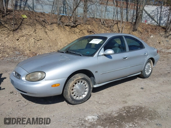 1999 Mercury Sable LS z VIN 1MEFM53S7XA622932, wystawiony jako IAAI lot #41708531 z przebiegiem 155 702 mil mil oraz . Historia ofert i sprzedaży dostępna na DreamBid. Obrazek 2.