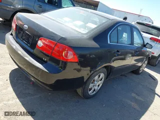 2008 Kia Optima LX with VIN KNAGE123985242231, listed as a IAAI auction lot 41838786 with 217,754 mi miles. Bid and sale history available at carsss.com. Image 4.