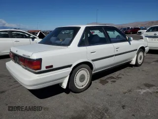 1991 Toyota Camry z VIN 4T1VV22E9MU060249, wystawiony jako Copart lot #51387785 z przebiegiem 153 405 mil mil oraz Czysty tytuł • Clean title. Historia ofert i sprzedaży dostępna na DreamBid. Obrazek 3.