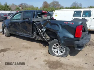 2018 Chevrolet Colorado 4WD LT z VIN 1GCGTCEN7J1162182, wystawiony jako IAAI lot #42108523 z przebiegiem 88 195 mil mil oraz . Historia ofert i sprzedaży dostępna na DreamBid. Obrazek 3.