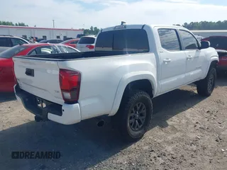 2023 Toyota Tacoma SR with VIN 3TYCZ5AN2PT112854, listed as a IAAI auction lot 42220025 with 43,657 mi miles and . Bid and sale history available at DreamBid. Image 4.