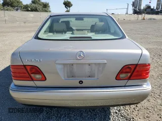 1999 Mercedes-Benz E-Class with VIN WDBJF65H5XA804902, listed as a Copart auction lot 73704634 with 92,411 mi miles and Salvage Title. Bid and sale history available at carsss.com. Image 6.