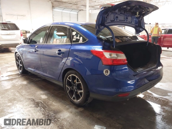 2014 Ford Focus SE with VIN 1FADP3F21EL194900, listed as a IAAI auction lot 41341333 with 103,245 mi miles. Bid and sale history available at carsss.com. Image 3.