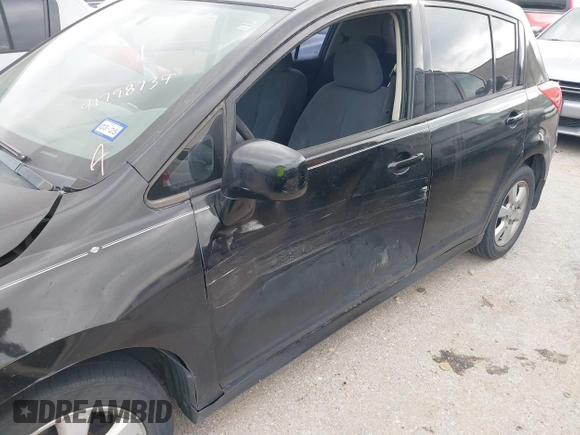 2009 Nissan Versa 1.8 SL with VIN 3N1BC13E59L496882, listed as a IAAI auction lot 41798734 with 210,907 mi miles. Bid and sale history available at carsss.com. Image 6.