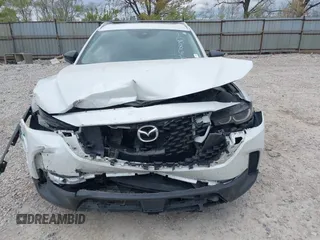 2023 Mazda CX-50 S Premium Plus with VIN 7MMVABEM7PN108865, listed as a IAAI auction lot 42049215 with 33,285 mi miles and . Bid and sale history available at DreamBid. Image 6.