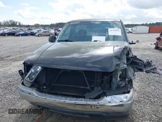 1999 GMC New Sierra 1500 SL with VIN 1GTEC14W2XZ512494, listed as a IAAI auction lot 41799076 with 210,710 mi miles. Bid and sale history available at carsss.com. Image 13.