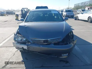 2005 Toyota Camry LE with VIN 4T1BF30K55U619313, listed as a IAAI auction lot 41854001 with 89,982 mi miles and . Bid and sale history available at DreamBid. Image 13.