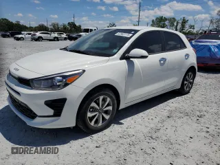 2023 Kia Rio S with VIN 3KPA25AD3PE558665, listed as a Copart auction lot 52983175 with 3,704 mi miles and Non Repairable. Bid and sale history available at DreamBid. Image 1.