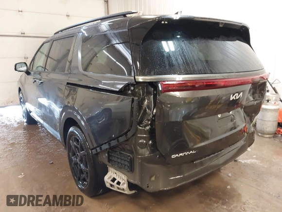 2025 Kia Carnival SX with VIN KNDNE5K33S6467800, listed as a IAAI auction lot 41624780 with 4,456 mi miles and . Bid and sale history available at DreamBid. Image 3.