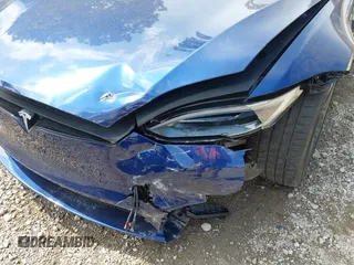 2022 Tesla Model S with VIN 5YJSA1E55NF486443, listed as a IAAI auction lot 42720110 with Not provided miles and . Bid and sale history available at DreamBid. Image 22.