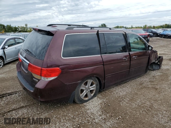 2010 Honda Odyssey Touring with VIN 5FNRL3H94AB056657, listed as a Copart auction lot 72658934 with 202,690 mi miles and Salvage title. Bid and sale history available at DreamBid. Image 3.