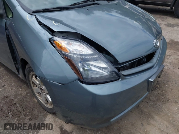 2005 Toyota Prius z VIN JTDKB20U853125464, wystawiony jako IAAI lot #42324259 z przebiegiem 166 742 mil mil oraz . Historia ofert i sprzedaży dostępna na DreamBid. Obrazek 12.